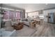 Open concept living room and kitchen area filled with natural light and modern design at 21947 E 51St Dr, Aurora, CO 80019