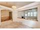 Bright living room with a decorative chandelier and fireplace view at 20576 E Caley Dr, Centennial, CO 80016