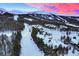 Aerial view of luxurious homes in a snowy mountain community at 457 Timber Trail Rd, Breckenridge, CO 80424