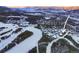 Aerial view of a luxury home community nestled in a snowy mountain setting at 457 Timber Trail Rd, Breckenridge, CO 80424