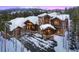 Luxury home with stone and wood exterior at 457 Timber Trail Rd, Breckenridge, CO 80424