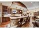 Basement wet bar with granite countertops and wooden cabinetry at 457 Timber Trail Rd, Breckenridge, CO 80424