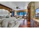 Luxurious main bedroom with a plush bed, fireplace, and mountain views at 457 Timber Trail Rd, Breckenridge, CO 80424