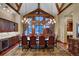 Formal dining room with hardwood floors, a large table, and scenic views at 457 Timber Trail Rd, Breckenridge, CO 80424
