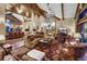 Elegant living room showcasing a stone fireplace and ample natural light at 457 Timber Trail Rd, Breckenridge, CO 80424