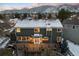 Aerial view of the home, highlighting the deck, and mountain views in the background, creating a serene living environment at 6 White Alder, Littleton, CO 80127