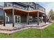 This backyard features a spacious patio with a covered deck above, offering great outdoor living and entertaining space at 6 White Alder, Littleton, CO 80127