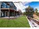 This backyard features a spacious patio with a covered deck above, offering great outdoor living and entertaining space at 6 White Alder, Littleton, CO 80127