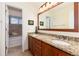 Bathroom with double vanity, granite countertops, and tile floors at 6 White Alder, Littleton, CO 80127