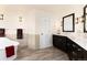 Bathroom featuring tub with tile surround, dark wood cabinets and tile floors at 6 White Alder, Littleton, CO 80127