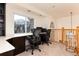 Bright home office with built-in desk, mountain views, and lots of natural light at 6 White Alder, Littleton, CO 80127