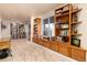 Library space with built-in shelving and window seating is perfect for book lovers at 6 White Alder, Littleton, CO 80127