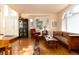 Spacious living room boasting hardwood floors, large windows, neutral paint, and comfortable seating at 6 White Alder, Littleton, CO 80127