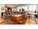 Spacious living room with large sectional sofa, hardwood floors, and large windows offering lots of natural light at 6 White Alder, Littleton, CO 80127