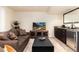 Cozy living room features a wet bar with granite countertops, perfect for entertaining guests at 6 White Alder, Littleton, CO 80127