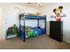 room with bunk bed, dresser, toys and ceiling fan at 1334 Barberry Trl, Elizabeth, CO 80107