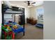 bedroom with bunkbeds, desk, and plenty of space for activities at 1334 Barberry Trl, Elizabeth, CO 80107