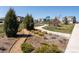 A community park with playground, green space, and walking path surrounded by residential homes at 1334 Barberry Trl, Elizabeth, CO 80107