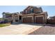 Charming two-story home featuring a three-car garage and a well-maintained front yard at 1334 Barberry Trl, Elizabeth, CO 80107