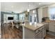 Open-concept kitchen overlooking dining and living areas features granite counters and stainless steel appliances at 1334 Barberry Trl, Elizabeth, CO 80107