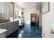 Stylish kitchenette with gray cabinets, unique flooring, and a modern sink at 1334 Barberry Trl, Elizabeth, CO 80107