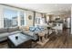 Open-concept living room featuring wood floors, natural light, and seamless flow to the kitchen at 1334 Barberry Trl, Elizabeth, CO 80107