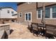 Paver patio with chairs and a table, perfect for enjoying outdoor living and entertaining at 1334 Barberry Trl, Elizabeth, CO 80107