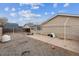 Backyard with a gravel area, concrete patio, and partial fencing, a blank canvas for outdoor enjoyment at 1418 5Th St, Fort Lupton, CO 80621