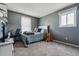 Cozy bedroom featuring a bed, desk, and natural light from a window, ideal for relaxation at 1418 5Th St, Fort Lupton, CO 80621