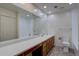 Bright bathroom featuring double sinks, and large mirror at 3515 S Dawson St, Aurora, CO 80014