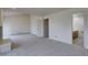 Spacious bedroom with neutral carpet, white trim, and access to an en-suite bathroom at 3515 S Dawson St, Aurora, CO 80014