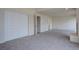 Bright bedroom with neutral carpet, closet, and two doors at 3515 S Dawson St, Aurora, CO 80014