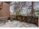 Inviting outdoor deck with brick accents and ivy, perfect for relaxation and enjoying the scenery at 3515 S Dawson St, Aurora, CO 80014