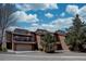Beautiful townhouse with brick facade, two-car garage, balcony and mature trees at 3515 S Dawson St, Aurora, CO 80014
