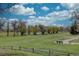 Expansive view of the golf course with lush greenery, water features, and mature trees at 3515 S Dawson St, Aurora, CO 80014