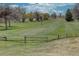 Scenic view of the golf course with lush green grass and mature trees at 3515 S Dawson St, Aurora, CO 80014