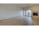 Spacious living room features brick fireplace and sliding glass doors at 3515 S Dawson St, Aurora, CO 80014