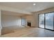 Bright living room with beamed ceiling, hardwood floors, and brick fireplace at 3515 S Dawson St, Aurora, CO 80014