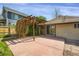 Concrete patio with a pergola attached to the house and a fenced in backyard at 2415 Chase St, Edgewater, CO 80214