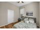 Comfortable bedroom with hardwood floors, neutral walls, and a plush bed at 2415 Chase St, Edgewater, CO 80214