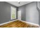Bedroom with hardwood floors and a window at 2415 Chase St, Edgewater, CO 80214