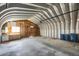 Interior of the metal frame garage with cabinets and a workbench at 2415 Chase St, Edgewater, CO 80214