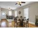 Bright living space with hardwood floors, ceiling fans, a dining table and comfortable seating providing a cozy and inviting atmosphere at 2415 Chase St, Edgewater, CO 80214