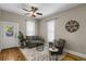 Comfortable living room with hardwood floors and bright, natural light showcasing an inviting and cozy space at 2415 Chase St, Edgewater, CO 80214