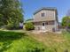 Spacious backyard with lush green grass and a patio area, perfect for outdoor entertaining at 12555 Eastlake Dr, Thornton, CO 80241