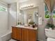 Updated full bathroom with shower/tub combo and vanity with a large mirror at 12555 Eastlake Dr, Thornton, CO 80241