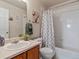 Bright bathroom with a shower-tub combo, single sink vanity, neutral colors, and lovely decorations at 12555 Eastlake Dr, Thornton, CO 80241