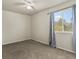 This bedroom features plush carpet, a ceiling fan, and a window at 12555 Eastlake Dr, Thornton, CO 80241