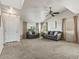 Spacious living room with high ceilings, tile entryway, and large windows at 12555 Eastlake Dr, Thornton, CO 80241