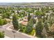 Nestled among trees, the property boasts mature landscaping, privacy, and a prime location at 403 Anderson St, Castle Rock, CO 80104